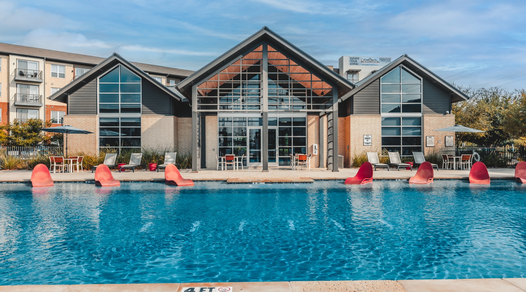 a pool with a building in the background