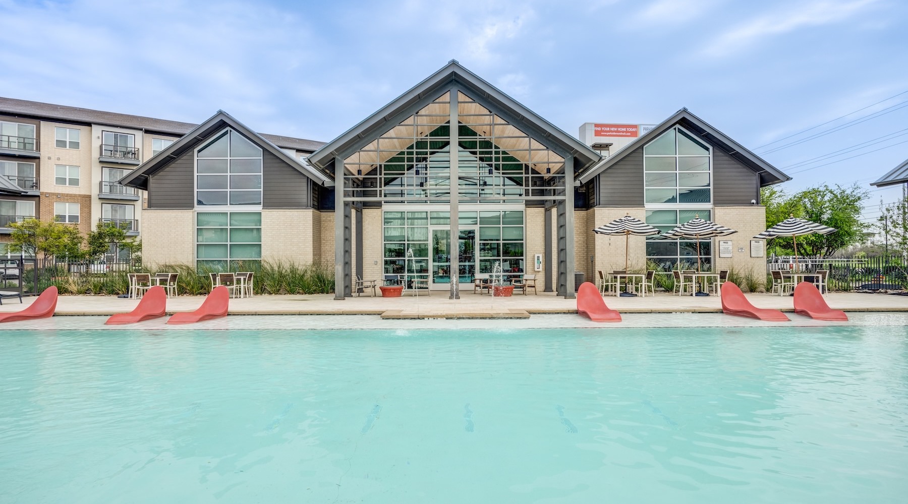 a pool with a building in the background