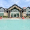 a pool with a building in the background