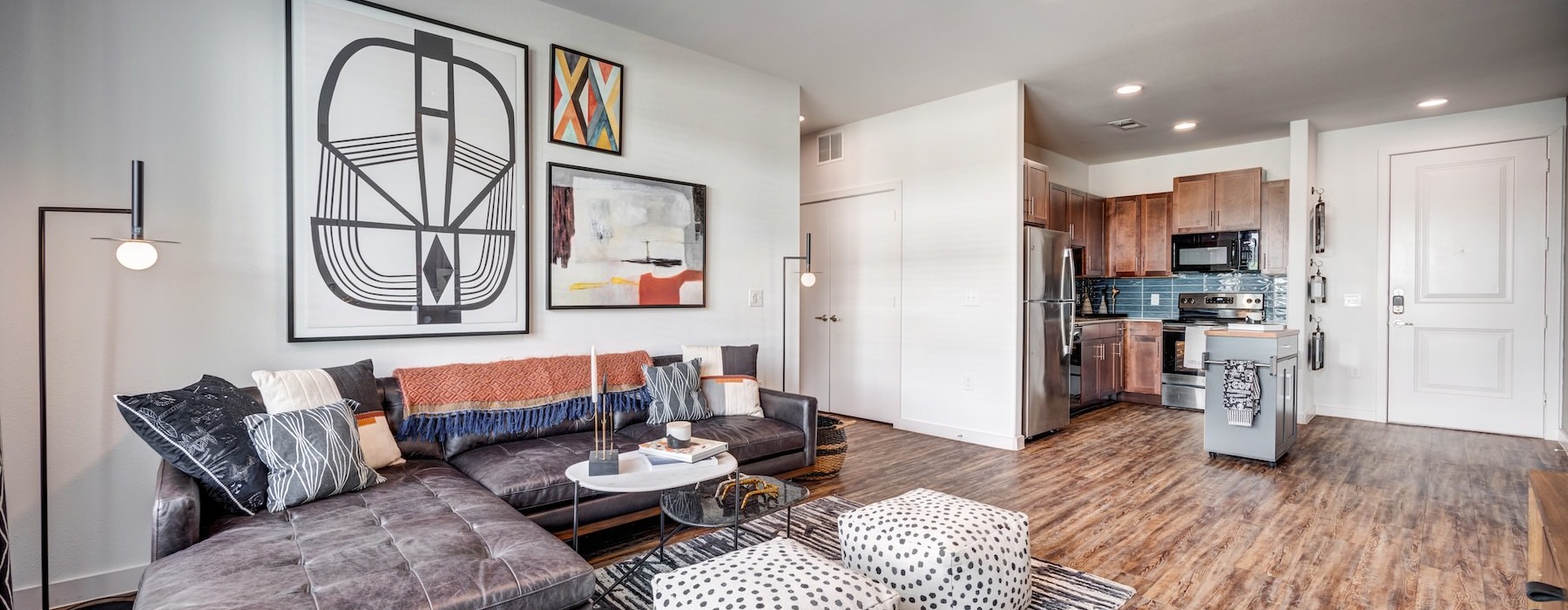 a living room with a couch and a fan